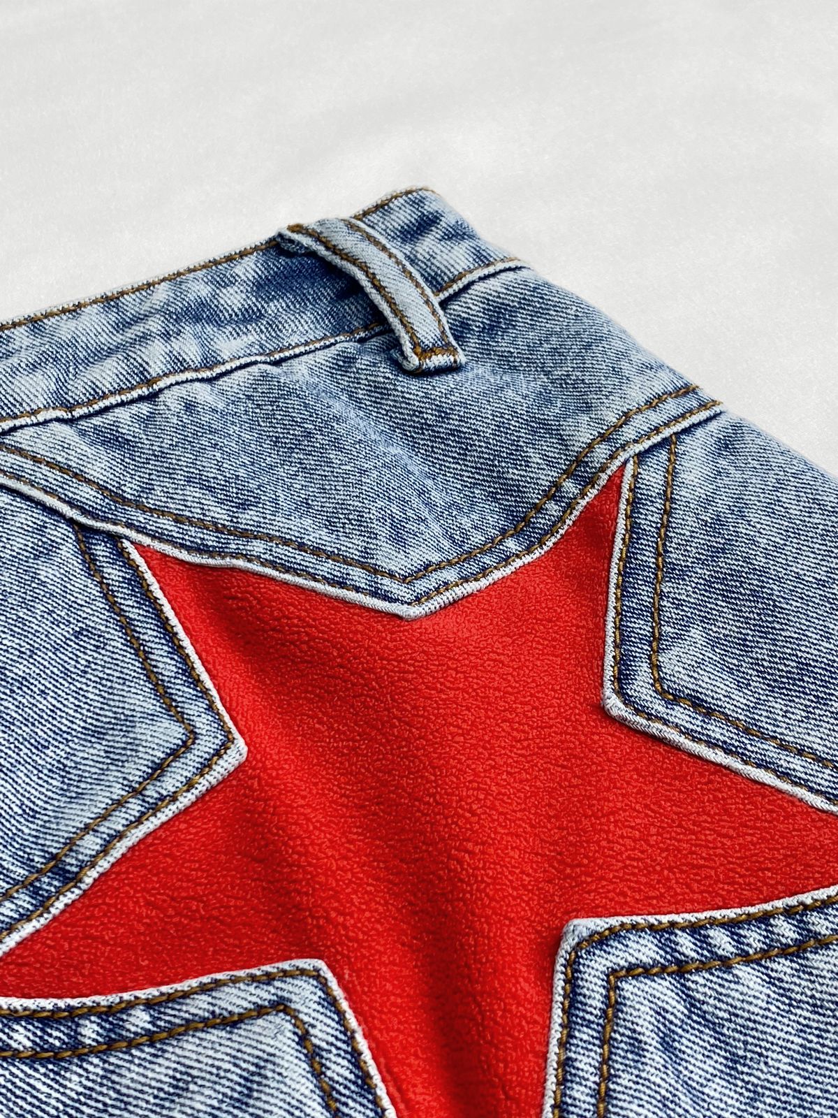 Star Patched Raw Hem Denim Shorts